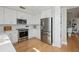 Bright, modern kitchen featuring stainless steel appliances and white cabinetry at 33 Calhoun St # 218, Charleston, SC 29401
