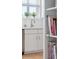 Close-up of a kitchen featuring stainless steel appliances, white cabinets, and a breakfast nook at 33 Calhoun St # 218, Charleston, SC 29401