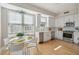 Bright eat-in kitchen with stainless steel appliances, white cabinets, and lots of natural light at 33 Calhoun St # 218, Charleston, SC 29401