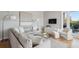 Comfortable living room featuring a sectional sofa, glass coffee table, and access to a balcony at 33 Calhoun St # 218, Charleston, SC 29401