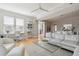 Bright living room with desk, comfortable seating area, and large windows at 33 Calhoun St # 218, Charleston, SC 29401