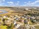 Panoramic aerial view of a coastal community, showcasing marshlands, homes, and waterways at 4258 Jacobs Pt Ct, Ravenel, SC 29470