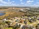 Charming neighborhood nestled along a scenic river with lush greenery and water views from above at 4258 Jacobs Pt Ct, Ravenel, SC 29470