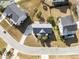 Aerial view of a home, highlighting the well-maintained lawn, landscaping, and neighborhood layout at 4258 Jacobs Pt Ct, Ravenel, SC 29470
