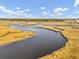 Expansive marshland meets tranquil riverways creating a serene natural backdrop with blue skies at 4258 Jacobs Pt Ct, Ravenel, SC 29470