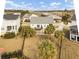 Aerial view of a home featuring a backyard with palm trees, a deck, and a fenced-in yard at 4258 Jacobs Pt Ct, Ravenel, SC 29470