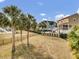 Spacious backyard features mature trees, a playground, and a fenced perimeter at 4258 Jacobs Pt Ct, Ravenel, SC 29470