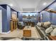 Finished basement offers comfortable seating, ample lighting, and a large entertainment screen at 4258 Jacobs Pt Ct, Ravenel, SC 29470