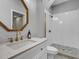 Stylish bathroom features modern fixtures, a white vanity, and a walk-in shower at 4258 Jacobs Pt Ct, Ravenel, SC 29470