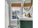 Well-lit bathroom with modern sink and faucet, stylish mirror, and window with a blind at 4258 Jacobs Pt Ct, Ravenel, SC 29470