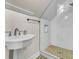 Modern bathroom features a walk-in shower, pedestal sink, and sleek fixtures at 4258 Jacobs Pt Ct, Ravenel, SC 29470