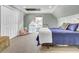 Cozy bedroom features soft blue walls, plush carpet, and ample closet space at 4258 Jacobs Pt Ct, Ravenel, SC 29470