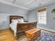 Charming bedroom with a hardwood floor, and a large wooden bed and chest at 4258 Jacobs Pt Ct, Ravenel, SC 29470
