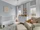 Charming Bedroom featuring a crib, dresser, comfortable seating, and soft, inviting decor at 4258 Jacobs Pt Ct, Ravenel, SC 29470