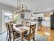 Inviting dining area open to the kitchen featuring a wooden table with seating for six at 4258 Jacobs Pt Ct, Ravenel, SC 29470