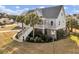 Charming coastal home featuring a welcoming porch, manicured landscaping, and delightful curb appeal at 4258 Jacobs Pt Ct, Ravenel, SC 29470