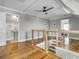 Bright hallway with hardwood floors and view of a sink and door at 4258 Jacobs Pt Ct, Ravenel, SC 29470