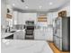 Spacious kitchen with modern appliances, white countertops and cabinets, and ample natural light at 4258 Jacobs Pt Ct, Ravenel, SC 29470