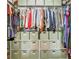 Well-organized walk-in closet with custom shelving, hanging rods, and storage bins for efficient storage at 4258 Jacobs Pt Ct, Ravenel, SC 29470