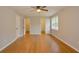 Bedroom features hardwood floors, a ceiling fan, and a closet at 488 Society Rd # A&B, McClellanville, SC 29458