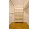 This is a walk-in closet with a built-in shelving unit and hanging bars for organized storage at 488 Society Rd # A&B, McClellanville, SC 29458