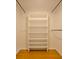 This is a walk-in closet with a built-in shelving unit and hanging bars for organized storage at 488 Society Rd # A&B, McClellanville, SC 29458