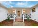 Inviting front porch with brick steps and modern lighting at 488 Society Rd # A&B, McClellanville, SC 29458