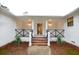 Inviting front porch with brick steps and modern lighting at 488 Society Rd # A&B, McClellanville, SC 29458