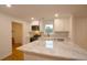 Bright kitchen features white cabinetry, marble counters and a stainless steel appliance package at 488 Society Rd # A&B, McClellanville, SC 29458