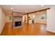 Spacious living room with hardwood floors and modern fireplace at 488 Society Rd # A&B, McClellanville, SC 29458