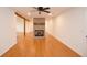 Spacious open-concept layout with a modern brick fireplace, hardwood floors, and natural light at 488 Society Rd # A&B, McClellanville, SC 29458
