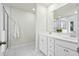 Bright bathroom featuring double sinks, marble countertops and floors, and glass enclosed shower at 491 Richfield Way, Summerville, SC 29486