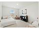 Well-lit bedroom with a single bed, shelving for storage and a large window at 491 Richfield Way, Summerville, SC 29486