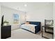 Comfortable bedroom with neutral tones, daybed, black desk and lots of natural light at 491 Richfield Way, Summerville, SC 29486