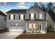 Beautiful two-story home featuring a covered porch and attached two-car garage at 491 Richfield Way, Summerville, SC 29486