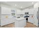 Well-lit kitchen offers a center island, stainless steel appliances and ample counter space at 491 Richfield Way, Summerville, SC 29486