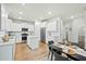 Modern kitchen featuring stainless steel appliances, white cabinetry, and a center island at 491 Richfield Way, Summerville, SC 29486