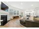 Open-concept living area flows to the kitchen with hardwood floors, fireplace, and sliding door access at 491 Richfield Way, Summerville, SC 29486