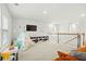 Spacious upstairs loft area with carpet, play tent, and cozy seating, perfect for a playroom at 491 Richfield Way, Summerville, SC 29486