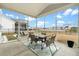 Outdoor screened porch with table and chairs, overlooking a view of the lake at 491 Richfield Way, Summerville, SC 29486