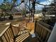 View from new wood deck down into the spacious backyard surrounded by mature trees at 515 Joseph St, Charleston, SC 29412