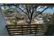 Balcony view showcasing mature trees and the surrounding neighborhood, offering a serene and private outdoor space at 515 Joseph St, Charleston, SC 29412