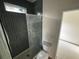Bathroom featuring shower with dark tile surround and new toilet at 515 Joseph St, Charleston, SC 29412