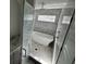 Modern bathroom featuring a soaking tub, tiled walls, a shower with glass door and sleek fixtures at 515 Joseph St, Charleston, SC 29412