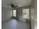 Bedroom featuring a ceiling fan and two windows providing natural light and outdoor views at 515 Joseph St, Charleston, SC 29412