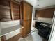 Well-organized laundry room with a built-in desk area and modern washer and dryer at 515 Joseph St, Charleston, SC 29412