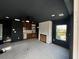 Spacious living room with dark walls, fireplace, ceiling fan and a view to outdoor scenery at 515 Joseph St, Charleston, SC 29412
