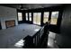 Open-concept living area with fireplace and large windows offering plenty of natural light and views at 515 Joseph St, Charleston, SC 29412