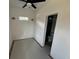 Empty room featuring small window with view to the backyard and open door to bathroom at 515 Joseph St, Charleston, SC 29412