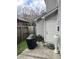 Fenced backyard features a grill, A/C Unit and door to access home at 527 Travelers Blvd, Summerville, SC 29485